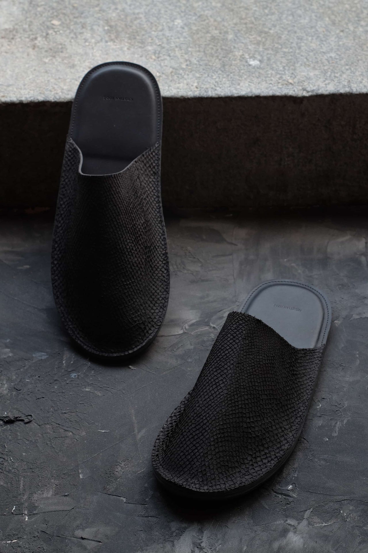 Sustainable luxury slippers in black fish leather, handcrafted by Kristian Eddé