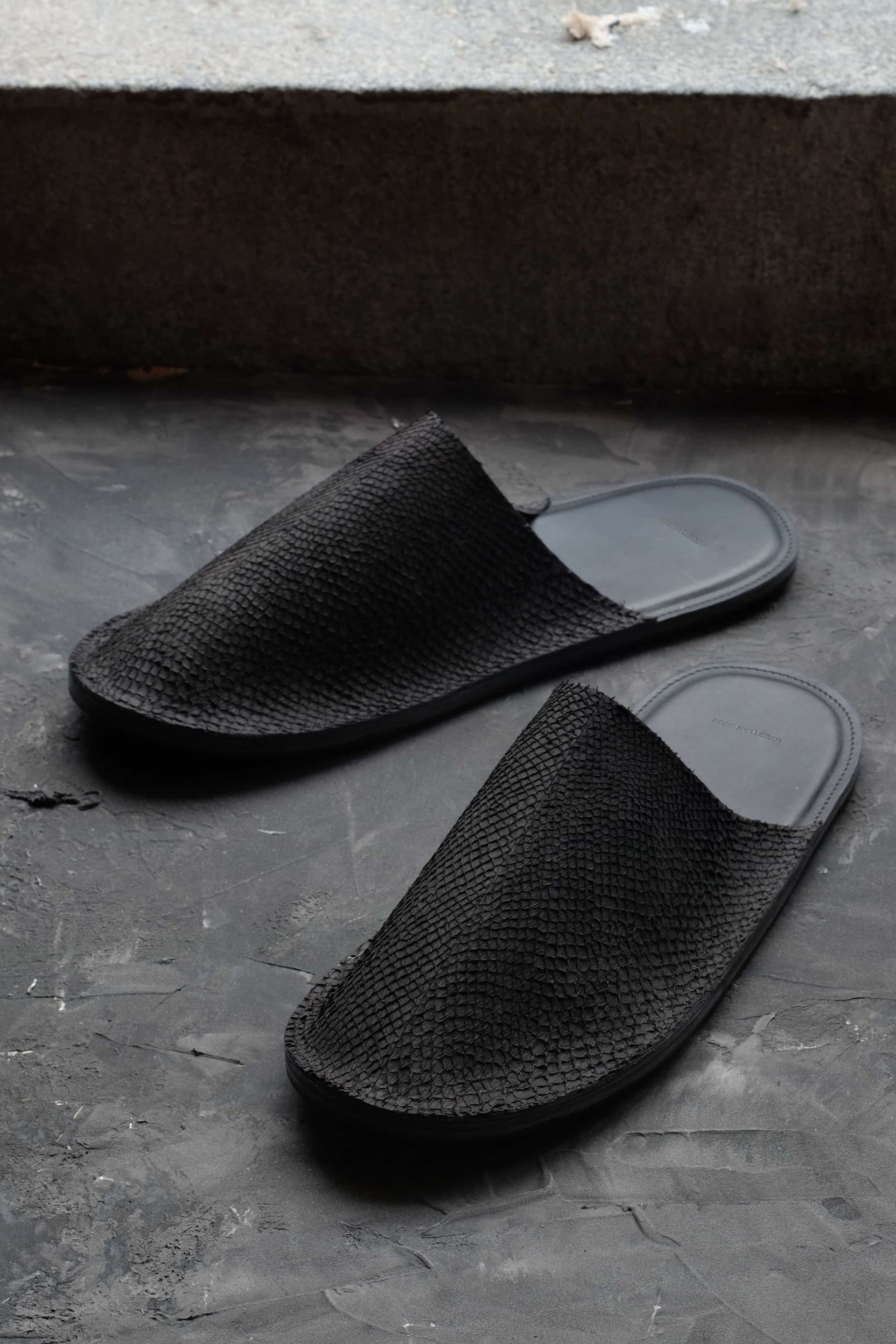 Luxury slippers in black salmon leather, handmade in Sweden by Kristian Eddé