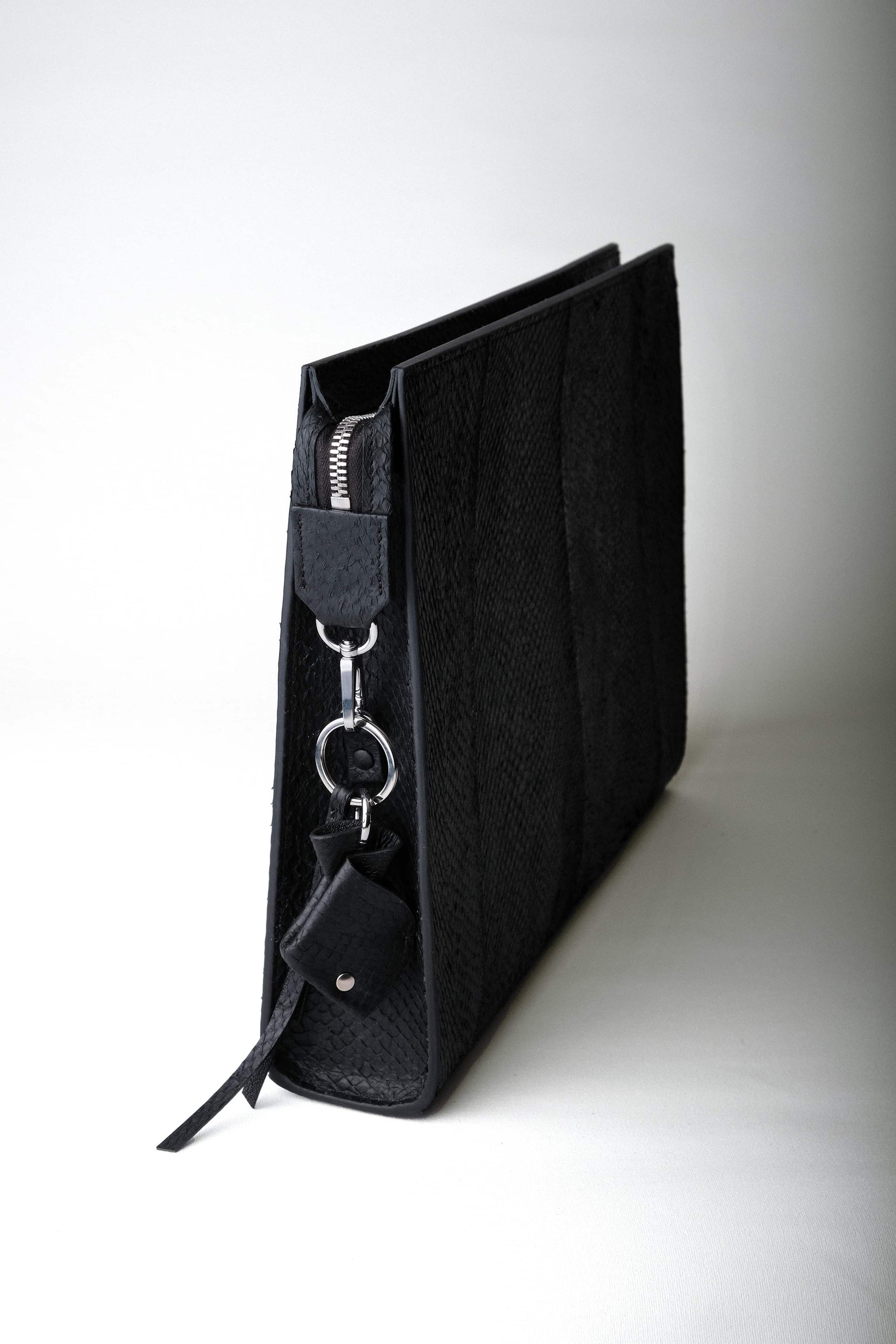 Baltic Clutch with detachable fish leather key charm, highlighting the accessory’s sustainability and craftsmanship