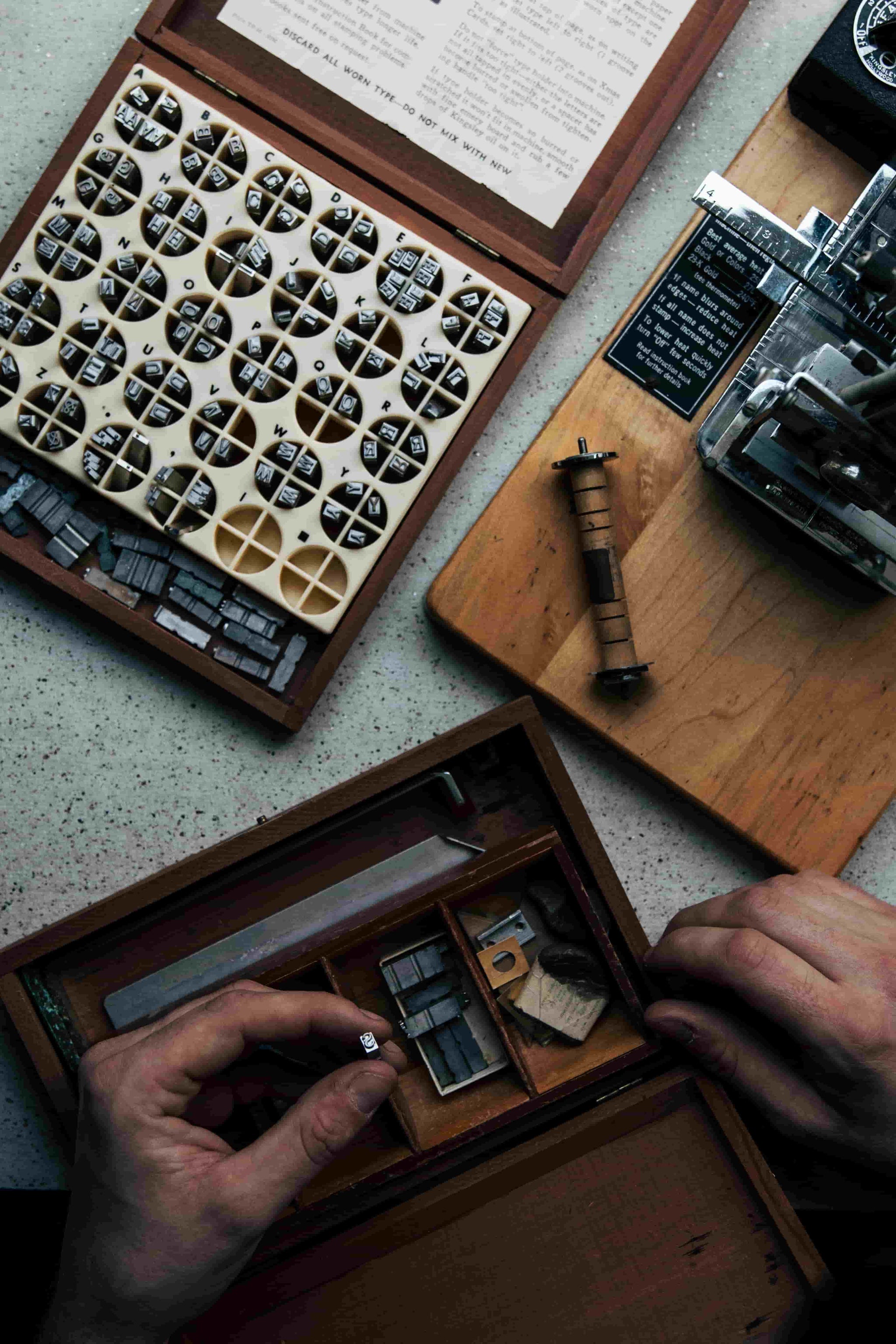 Kristian Eddé’s kingsley hot stamping machine with font samples, showcasing the embossing process on luxury leather products