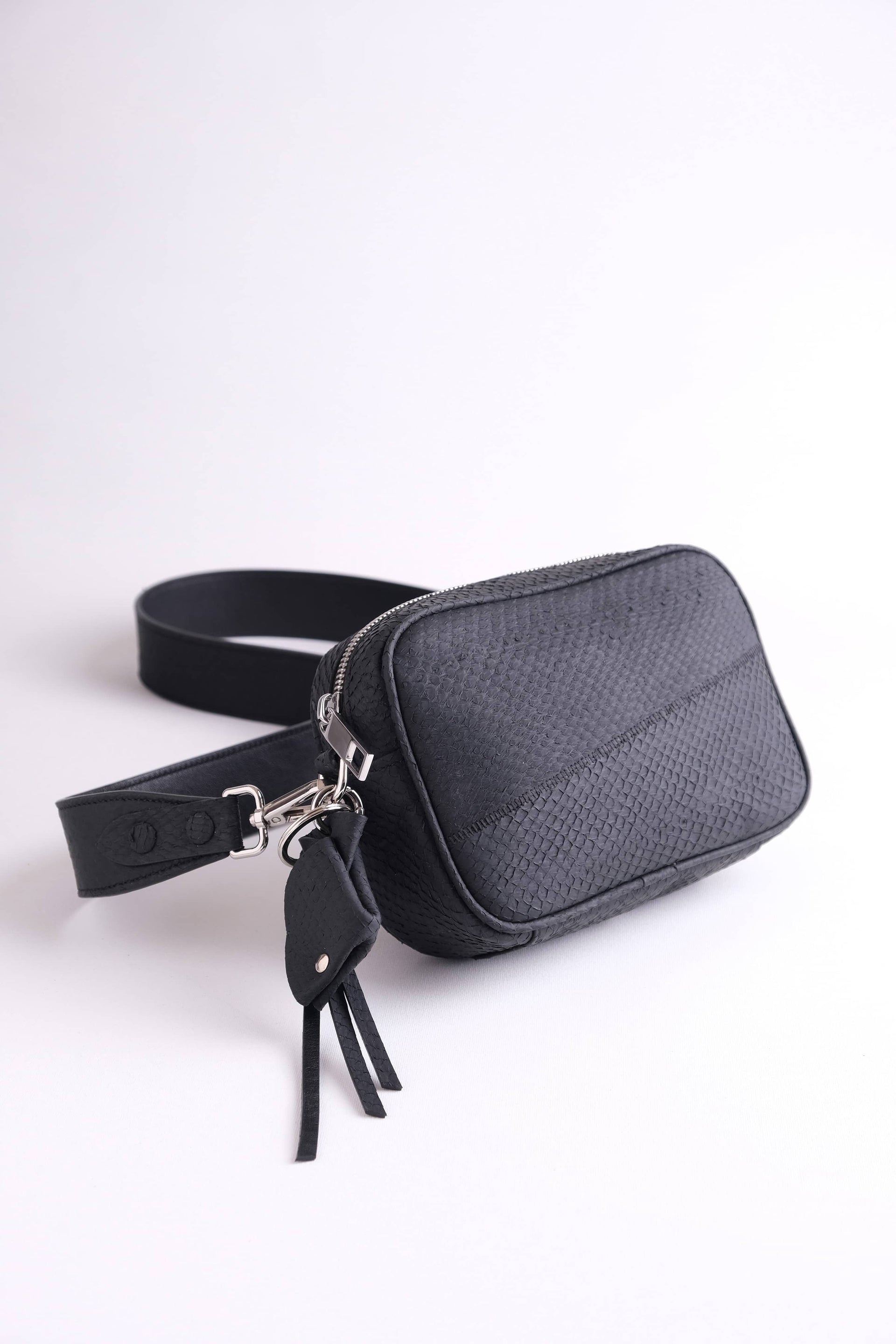 Luxury Kolga camera bag in arctic black salmon leather, shown with detachable shoulder strap in salmon and nappa leather