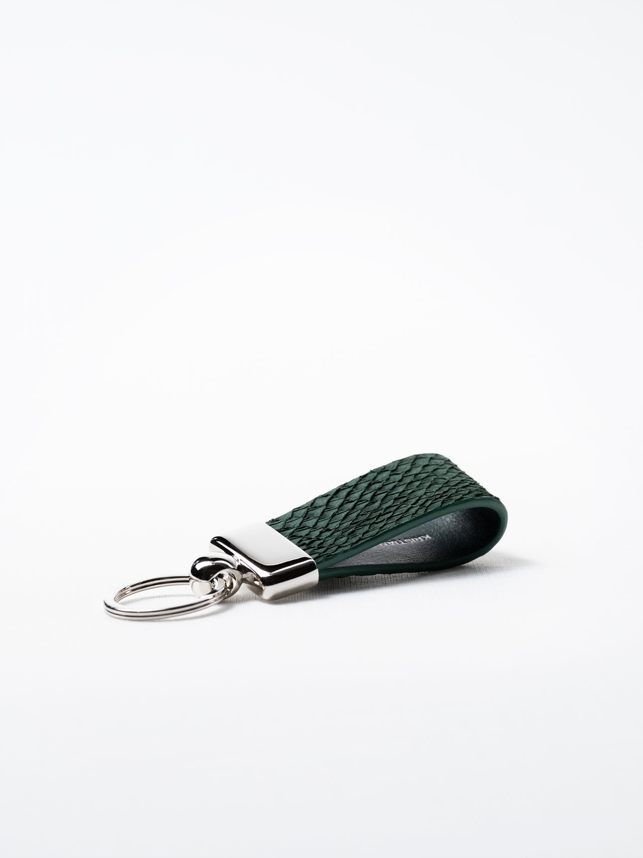 Kelp green salmon leather key ring, side view showing natural grain and silver hardware