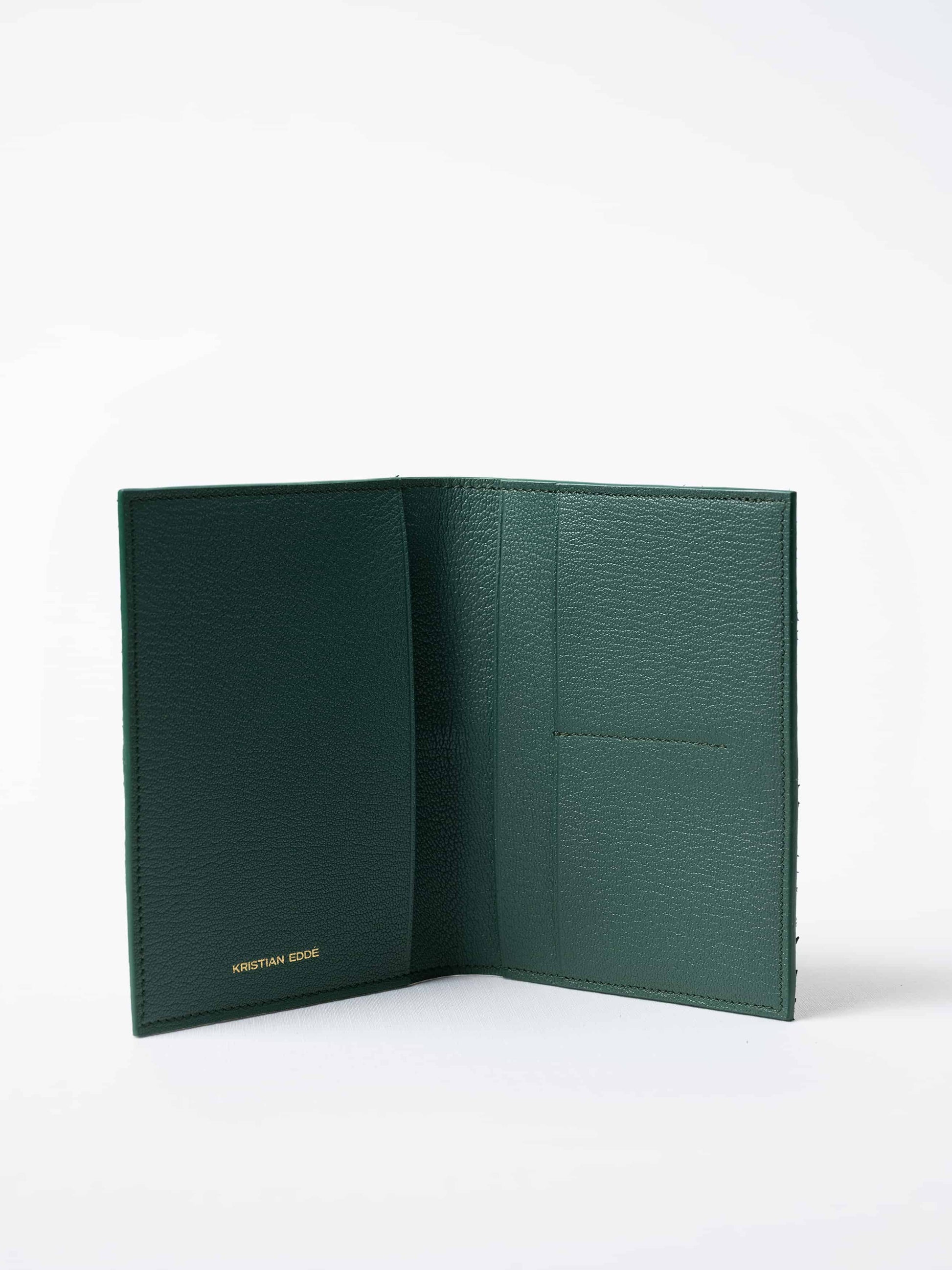 Vega luxury travel wallet in kelp green fish leather, fully open to show interior compartments, sustainable luxury by Kristian Eddé