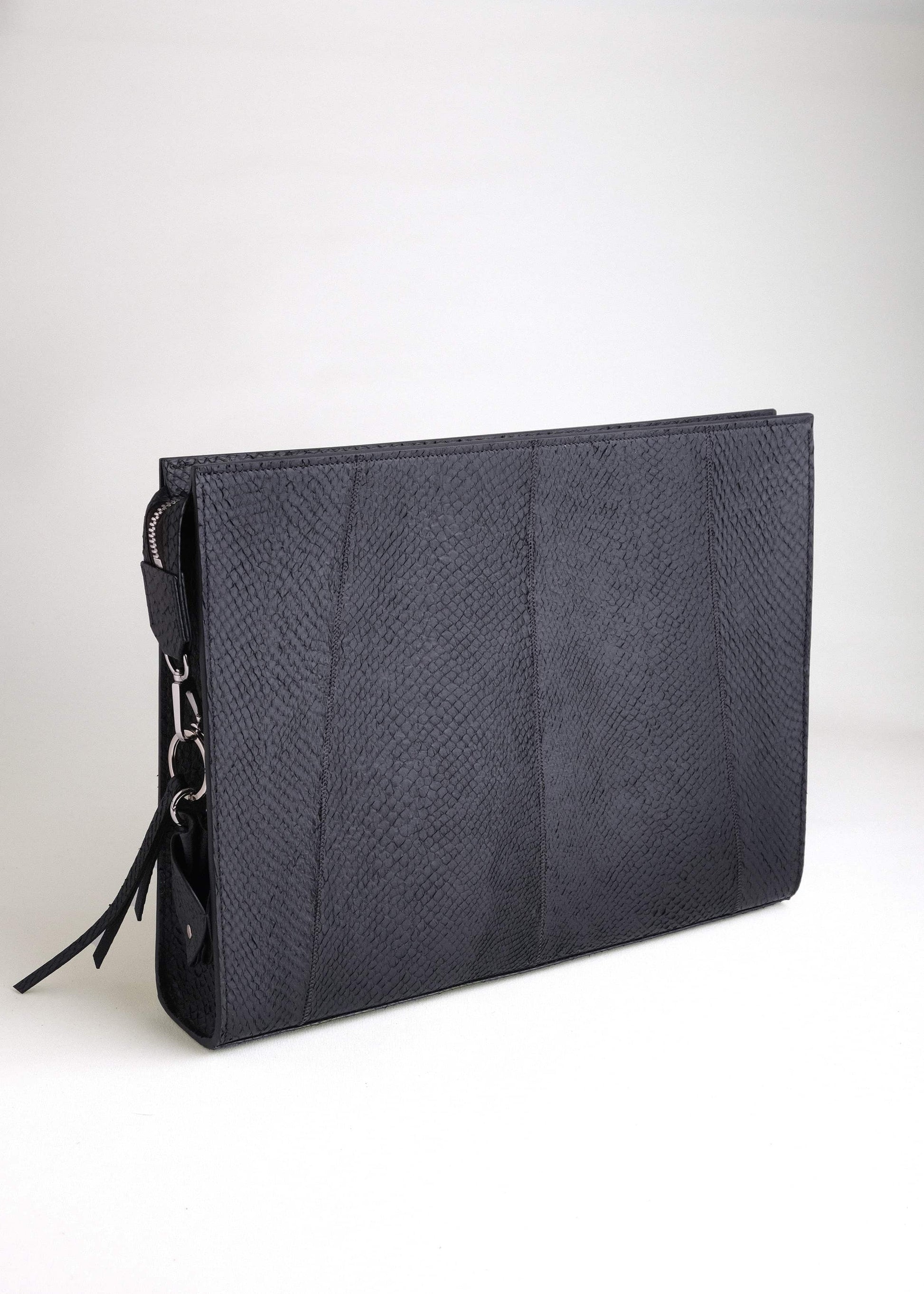 Front view of the Baltic Clutch in Arctic Black, crafted from naturally textured Scandinavian salmon leather with minimalist Nordic design