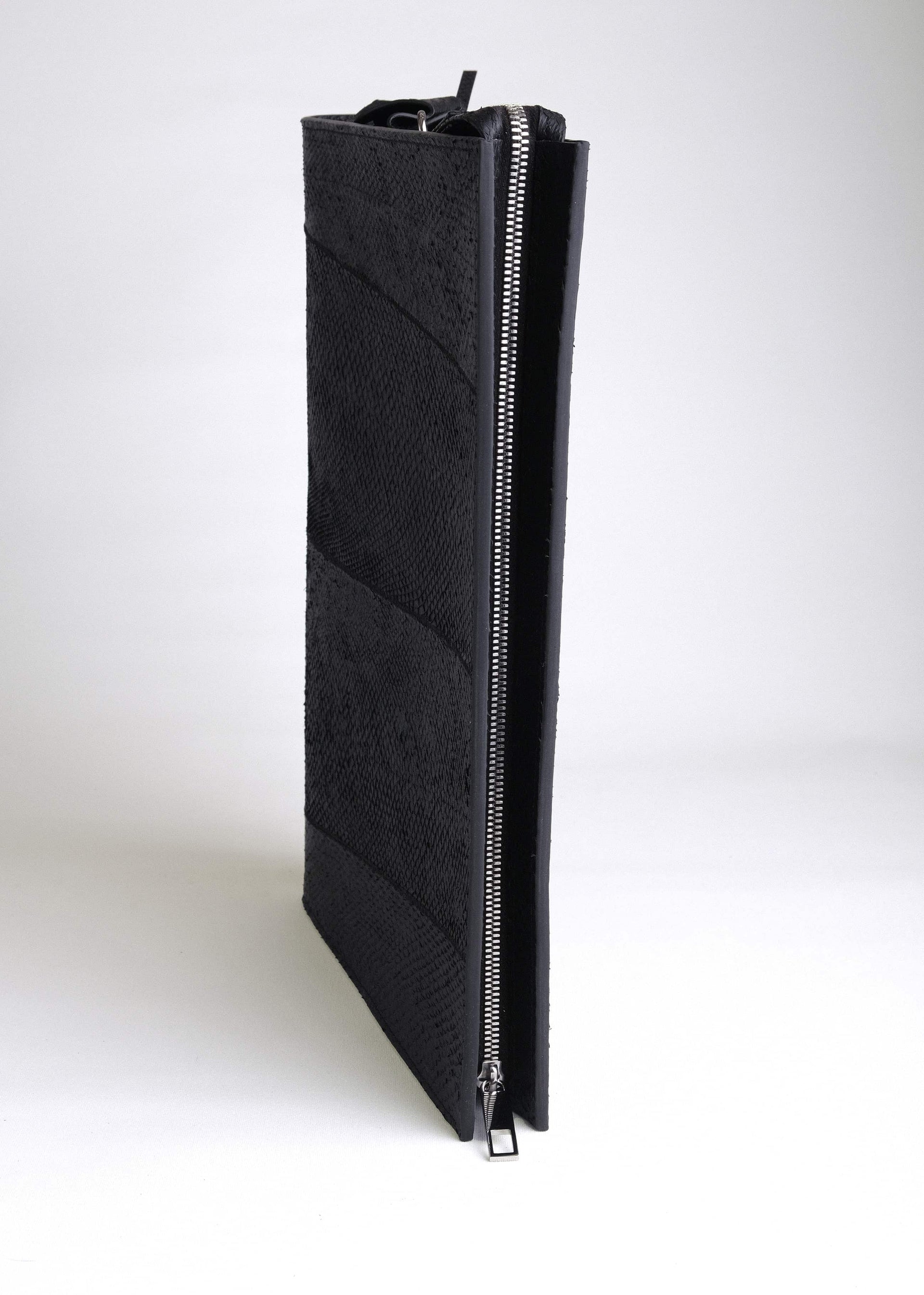Top view of the Baltic Clutch showing structured design and premium zipper closure in stainless steel