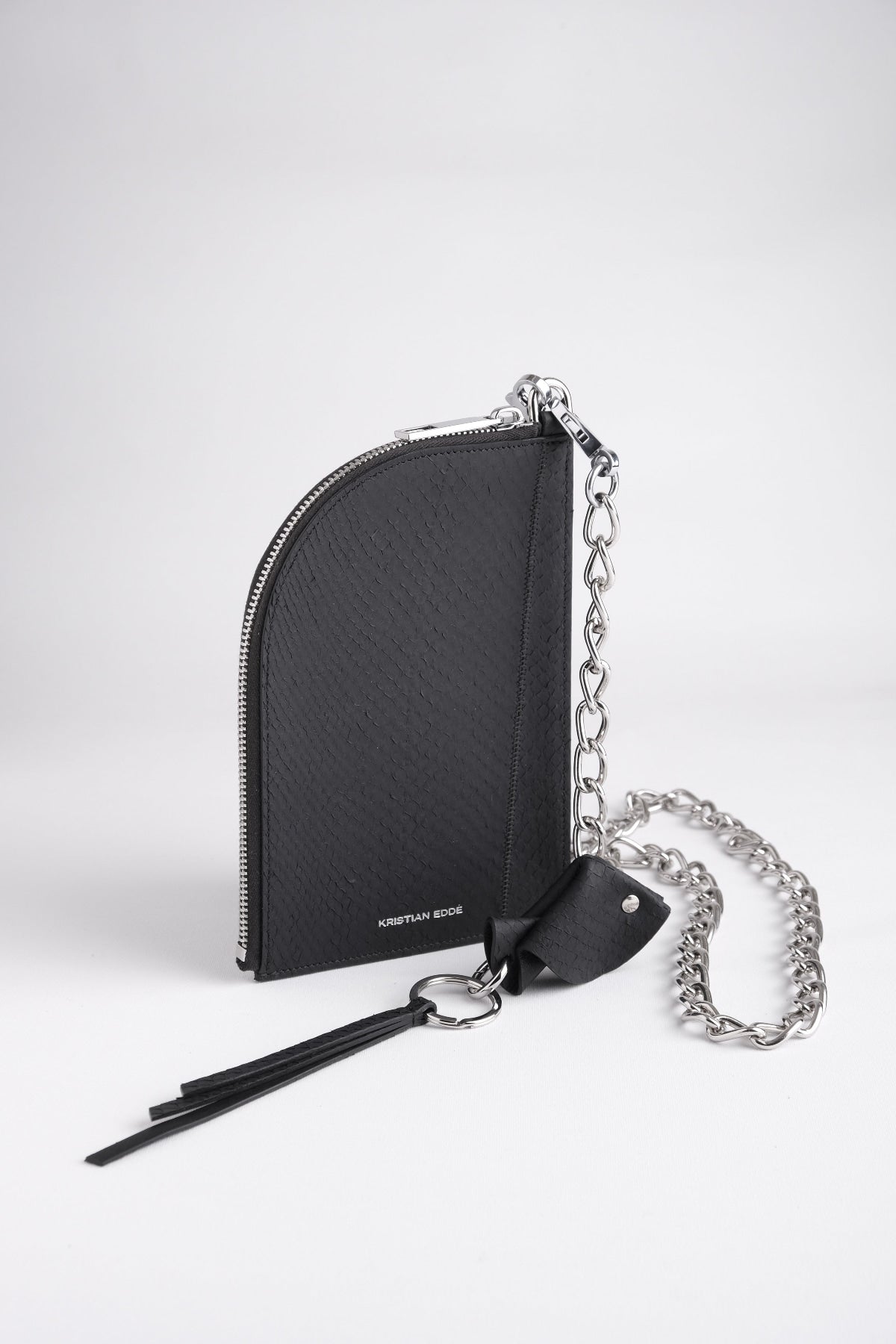 Nord salmon leather pouch with silver chain and fish key charm, arctic black, front view by Kristian Eddé
