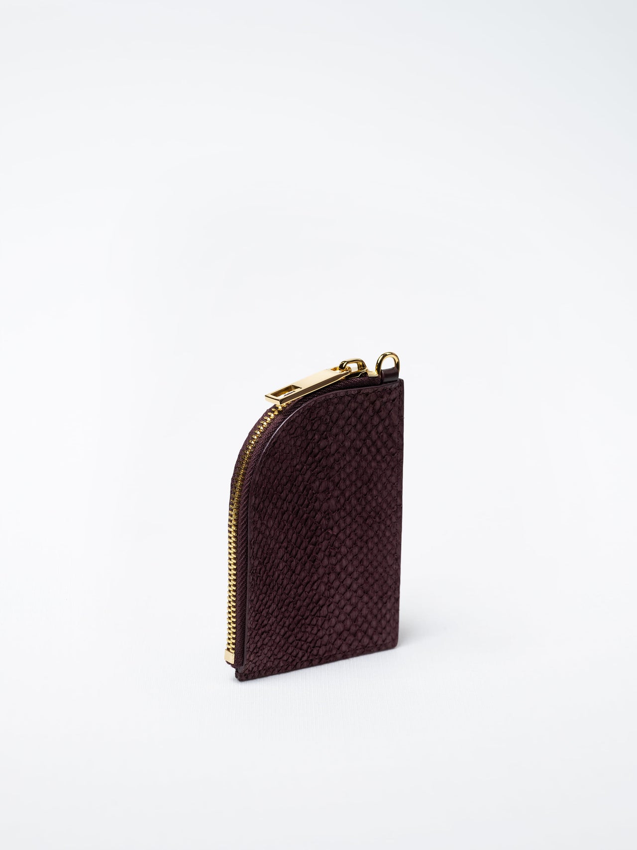Salma zipper wallet in burgundy salmon leather with gold zipper – handcrafted in Sweden by Kristian Eddé