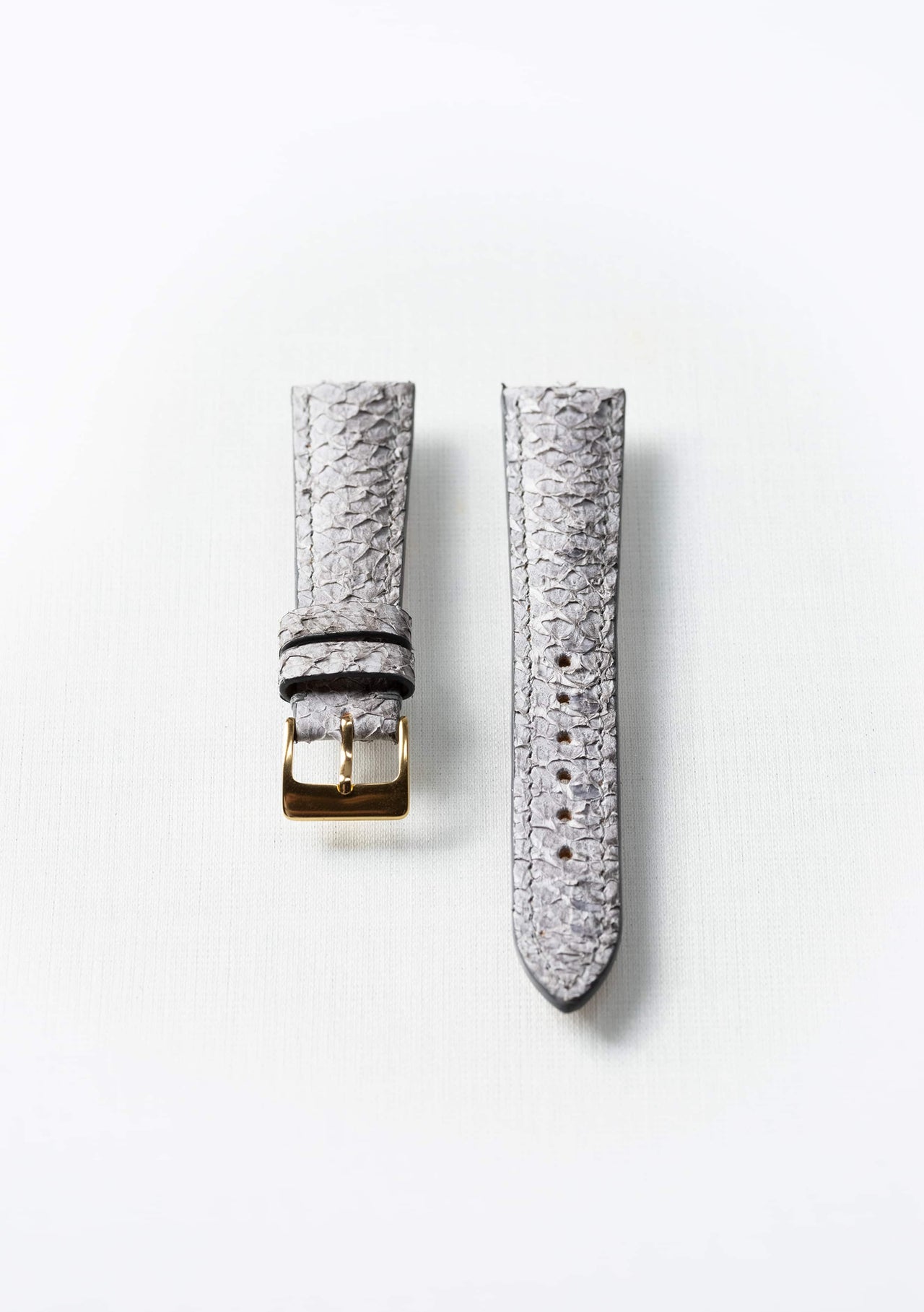 Himalayan gray fish leather watch strap with gold buckle, sustainable luxury accessory by Kristian Eddé