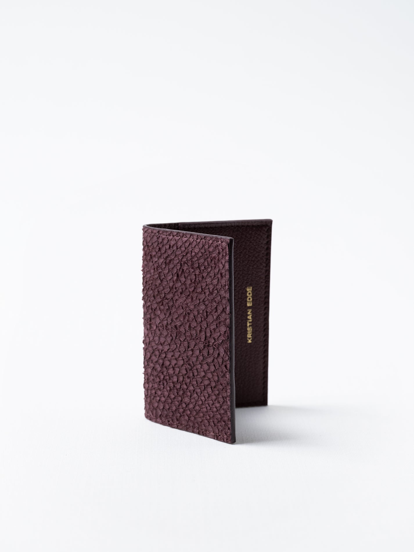 Barents cardholder made of  burgundy salmon leather, photographed on white background