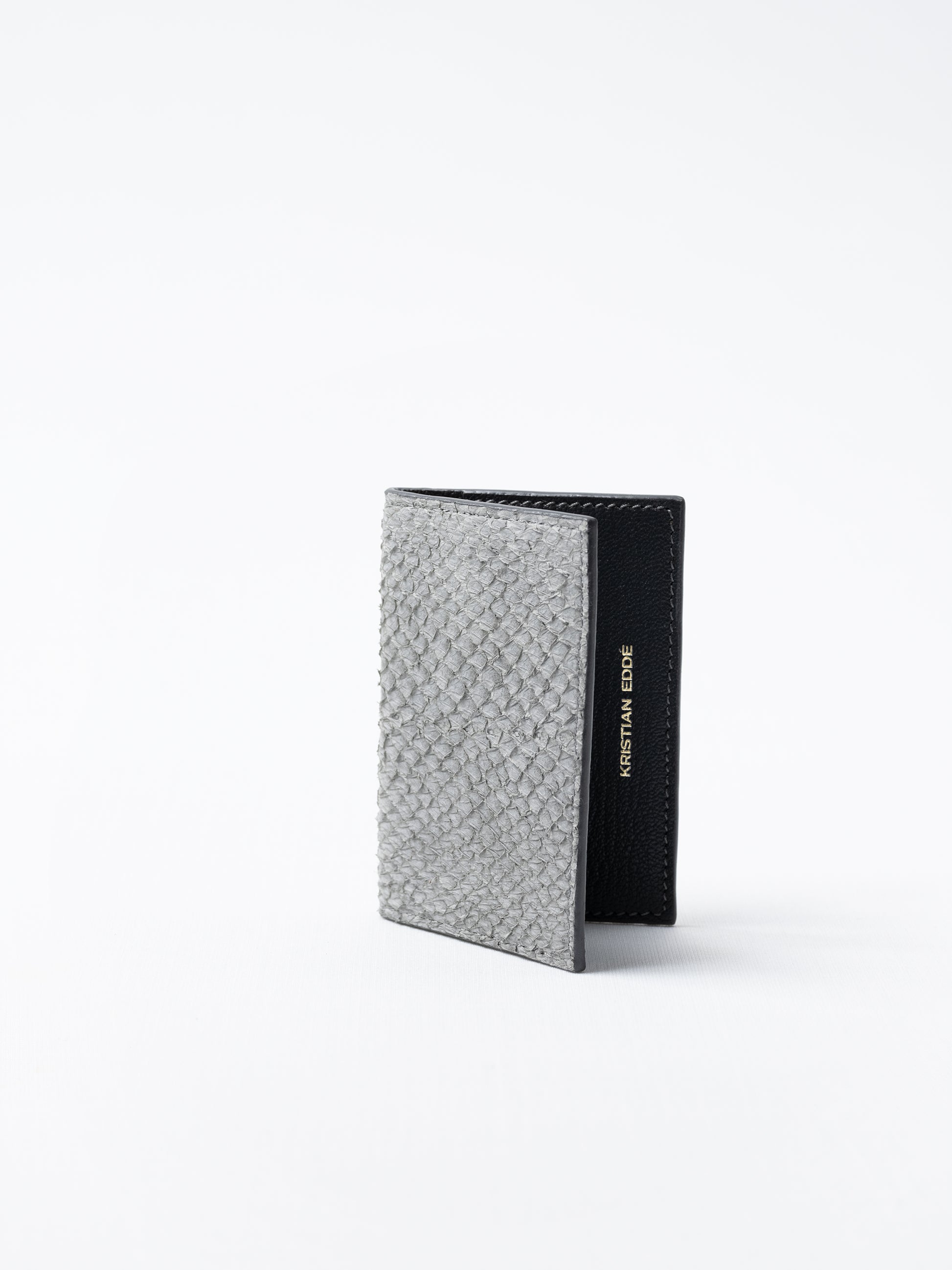 Barents cardholder made of  gray salmon leather, photographed on white background
