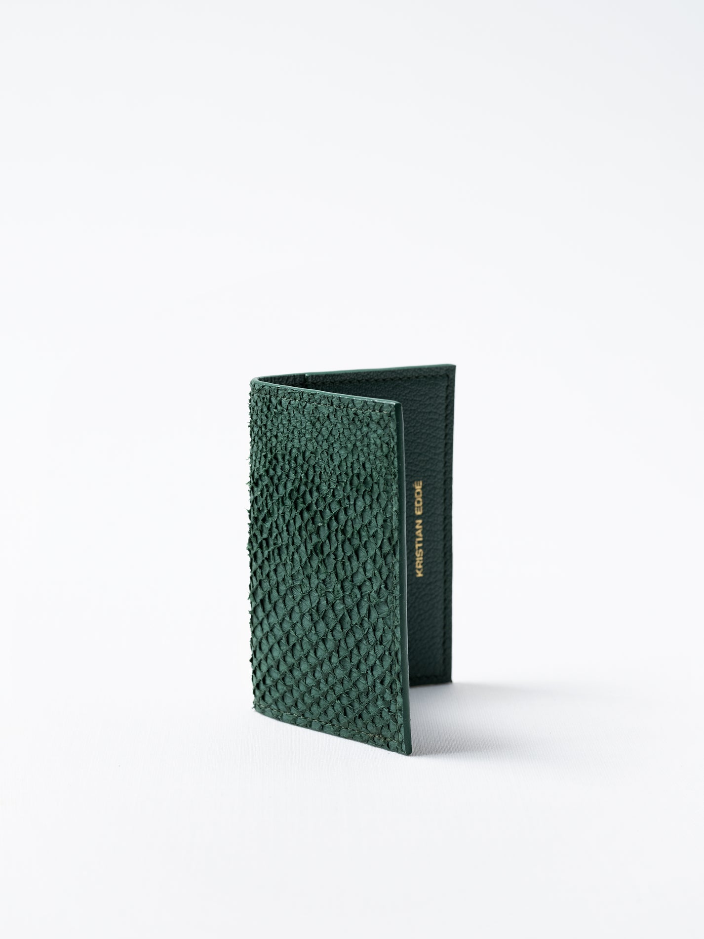 Barents cardholder made of  green salmon leather, photographed on white background