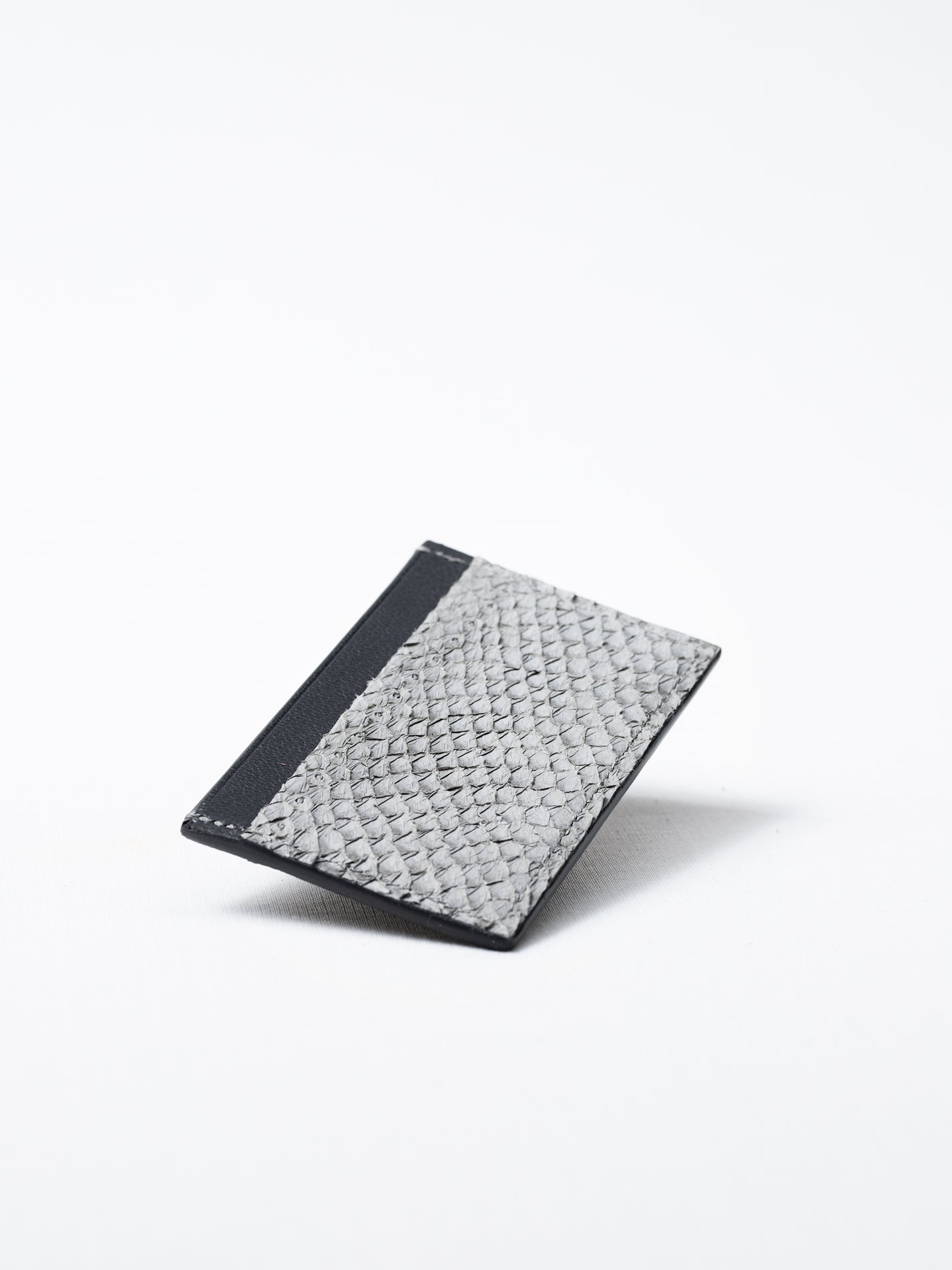 Bothnia gray card holder made of salmon leather, front view on white background