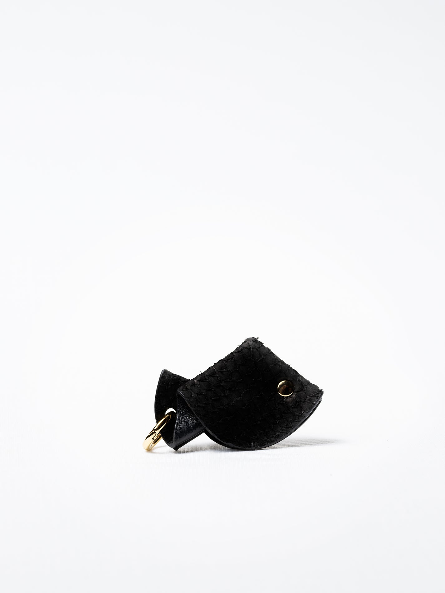 Fish key charm in black salmon leather, gold-plated key ring and lobster clasp detail