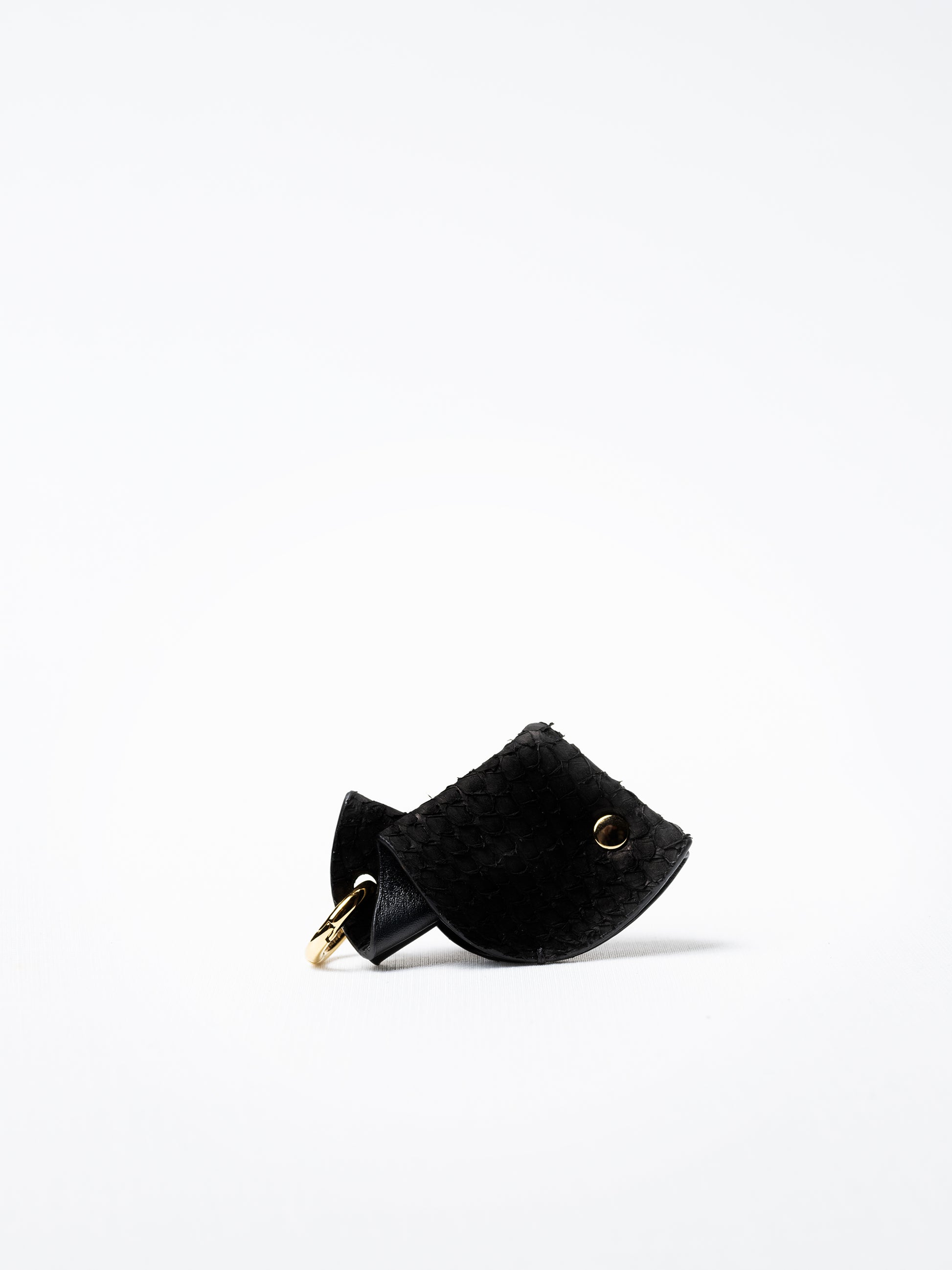 Fish key charm in black salmon leather, gold-plated key ring and lobster clasp detail