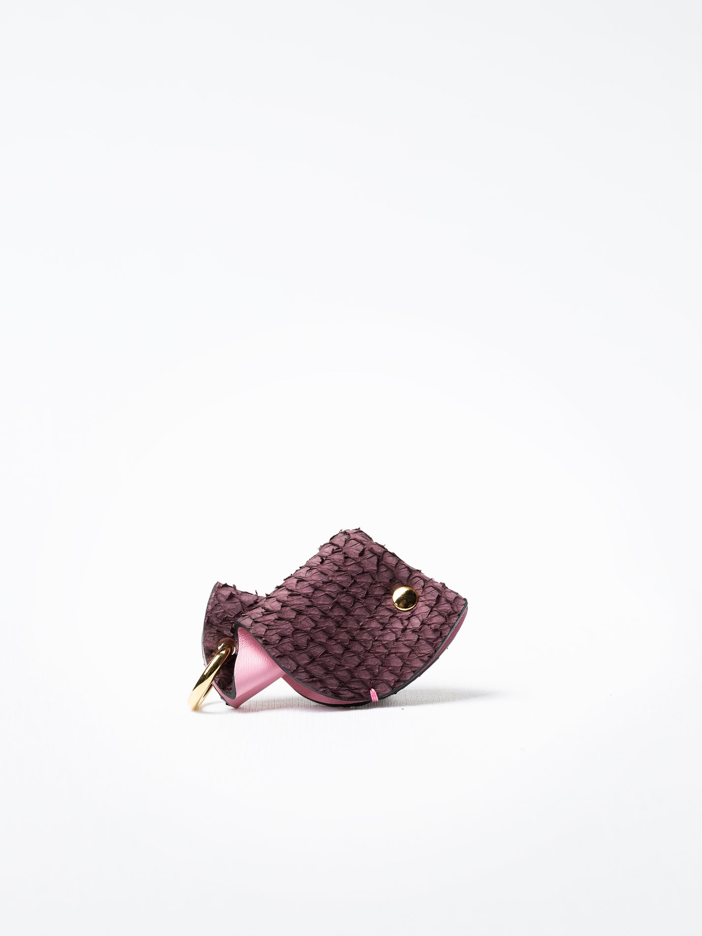 Fish key charm in pink salmon leather, shown with gold-plated key ring and clasp